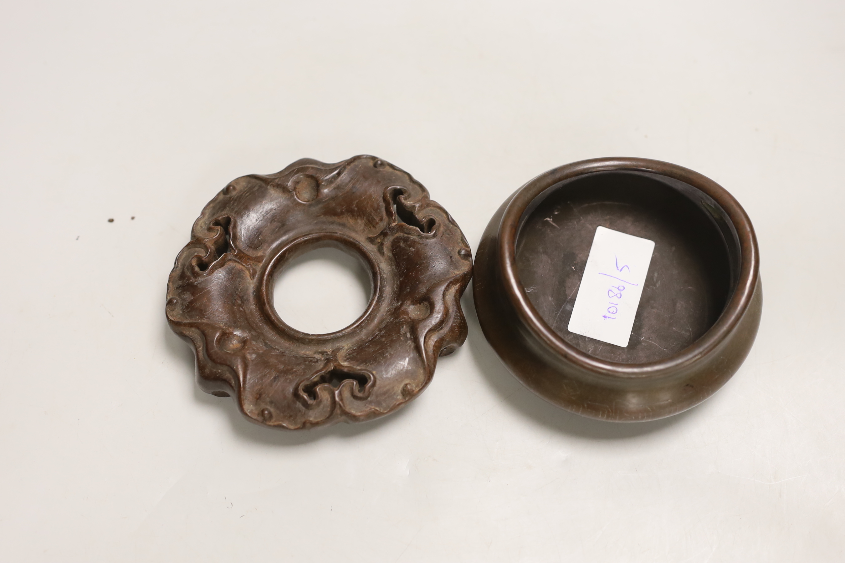 A Chinese bronze censer, on hardwood stand, 12.5cm diameter